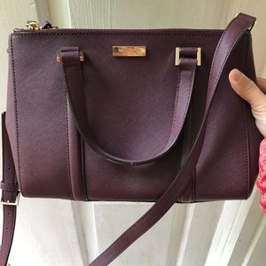 Wine colored Kate Spade cross body or short strap